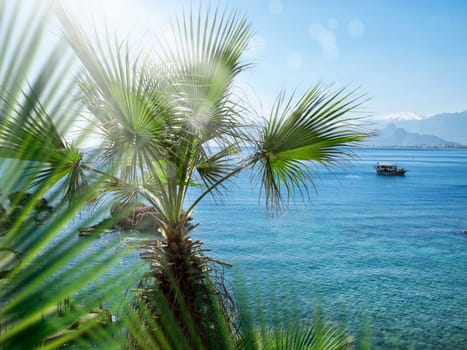 seascape image of people on sailing boat over sunny sky
