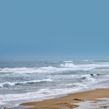 seascape image of waves on sea over stormy sky
