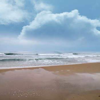 seascape image of waves on sea over stormy sky