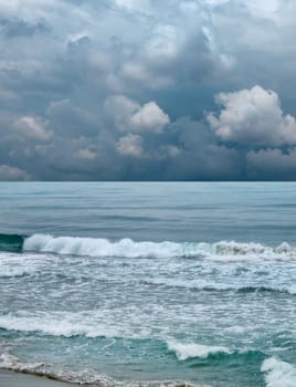 seascape image of waves on sea over stormy sky