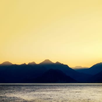seascape image of high mountains over clear sunset sky in Antalya, Turkey