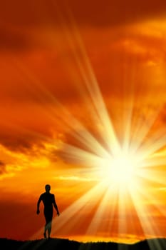 an image of man walking at sunset