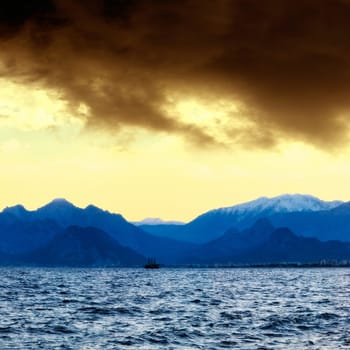 an image of a ship at sunset