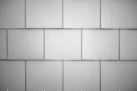 The façade of a building with wall cladding made of plastic panels.