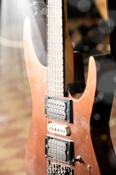 close up shot of a guitar with light beam