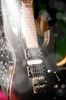 close up shot of a guitar with light beam