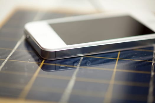 Green energy concept - Mobile Phone charging with solar power