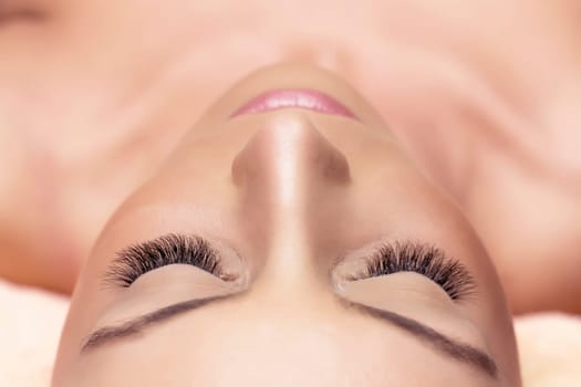 Treatment of Eyelash Extension. Lashes. Woman Eyes with Long Eyelashes.