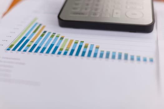 Business analysis - Checking accounting report on business table with calculator
