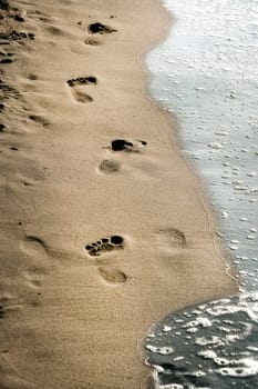 close up footprints on beach
