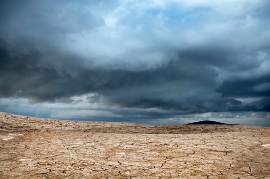 an image of mountain and cracked soil