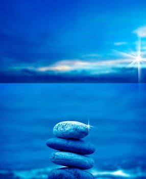 close up shot of stone pile over sea and morning sky.