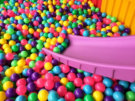 dry children's pool with colorful balls