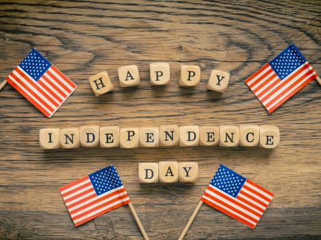 Small American flags on a rustic wooden background