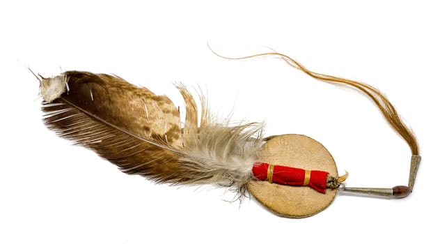 Eagle feather with horse hair as Indian hair ornament detached on white