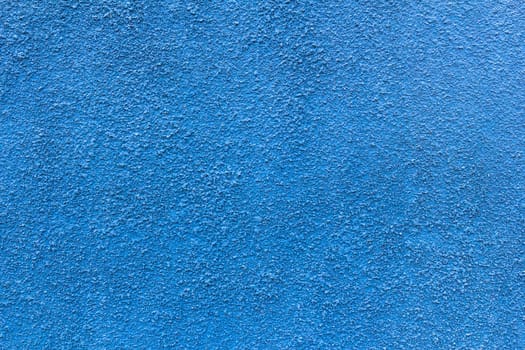 Abstract deep blue wall plastered texture. Rustic background.