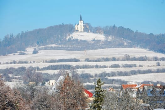 Hill with church in winter in Slovakia