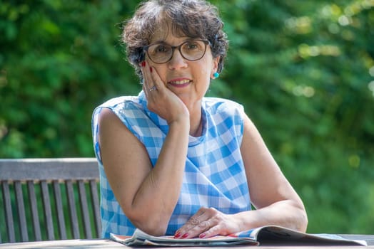 a portrait of a beautiful senior woman in the garden