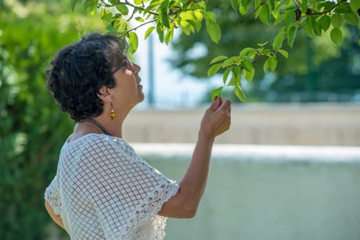 a portrait of a beautiful senior woman in the garden