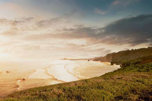 Ocean view with wave from cliff at sunset
