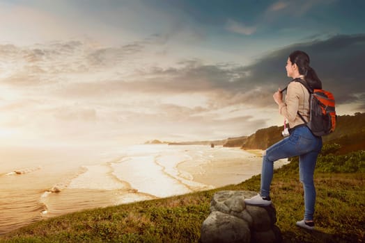 Young asian traveler woman enjoying panorama at sunset