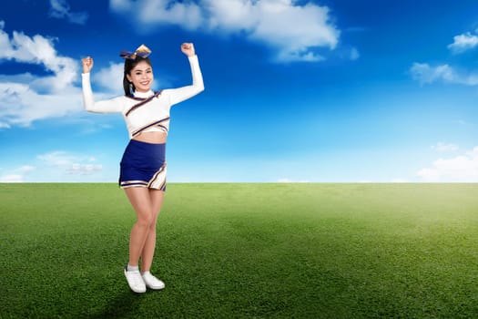 Young asian cheerleader performing at outdoor