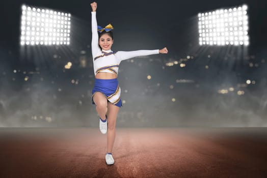 Young asian cheerleader in blue and white suit on the stadium