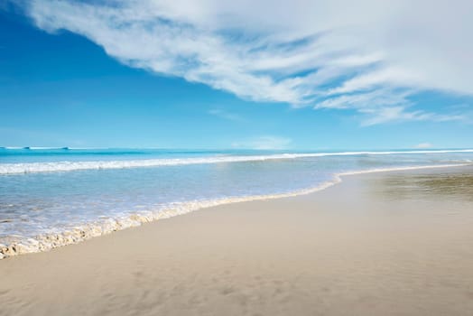 View of blue ocean with wave on the beach