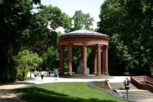 Bad Homburg,Germany - May 19,2018: Visitors and tourists visit the Elisabethenbrunnen in the Kurpark on May 19,2018 in Bad Homburg.