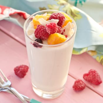 Fresh yoghurt drink with raspberries,mango and coconut