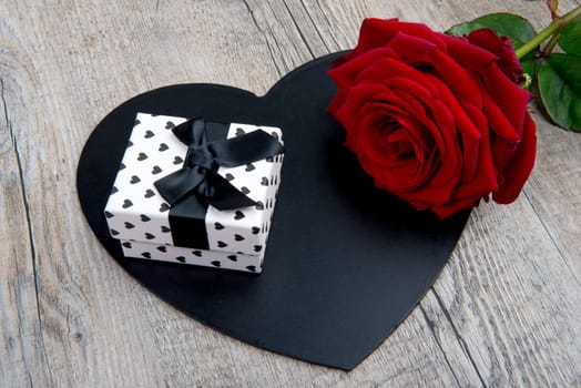 a heart, a rose and a gift for valentine day