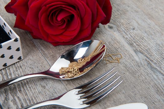valentine day's gift  with red rose and cutlery