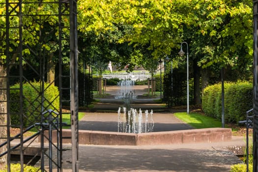 Small weir waterfall fountain in a public park
