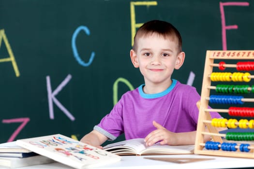 The boy goes to the first class at the school board