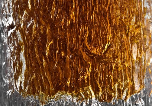 Abstract detail shot of scotch in a glass ideal for backdrop or background