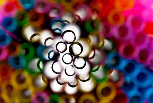 Abstract colourful image showing circles of bokeh with white off centre ideal for backdrops