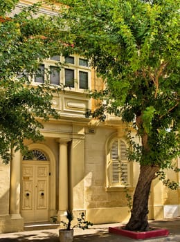 Typical features on a facade of a house in Malta