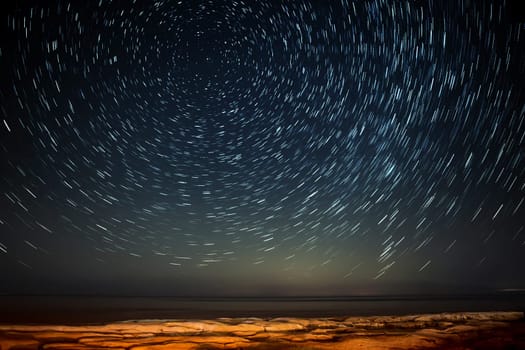 Extreme long exposure image showing star trails around the Polar Star or Polaris over Selmun in Malta