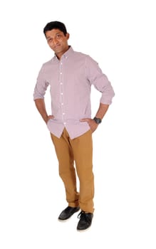 A handsome middle age man standing in a red checkered shirt with.his hands in pocket, looking at camera, isolated for white background.