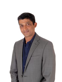 A close up image of the portrait of a east Indian business man in.a gray suit, isolated for white background.