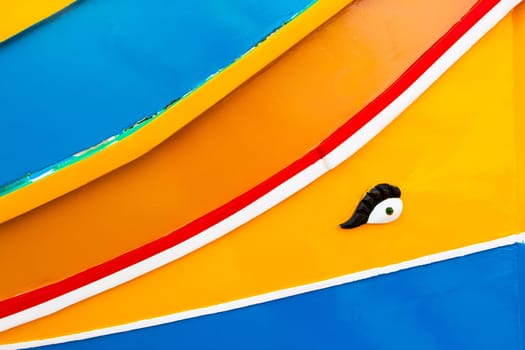 Abstract close up view of the vibrant colours and design usually used on the traditional Maltese fishing boat, the "Dghajsa"" or ""Luzzu""."