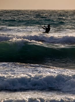Golden Bay, Malta - 30 Jan 2010 - Man enjoying kite surfing at Golden Bay in Malta