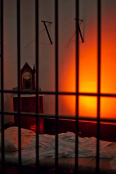 Empty bed in an eerie and spooky prison cell