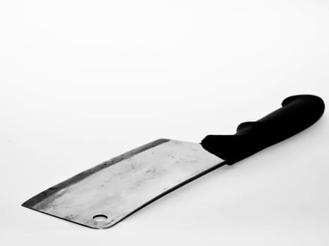 Cleaving knife over white backdrop