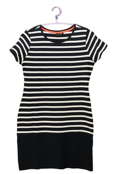 Fashionable summer clothes isolated on a white background. Black and white striped womans dress in marine style. Dress on a hanger. Summer fashion.
