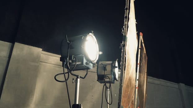 Big spotlight or lighting equipment for film movie or vdo shooting production in studio.