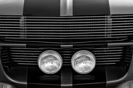 Detail abstract in monochrome showing front grille of a classic car