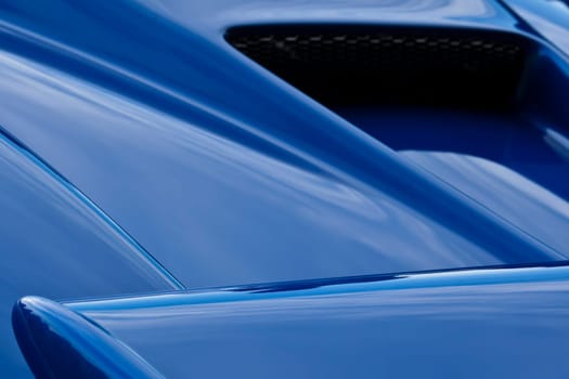 Abstract image showing detail form a blue sportscar
