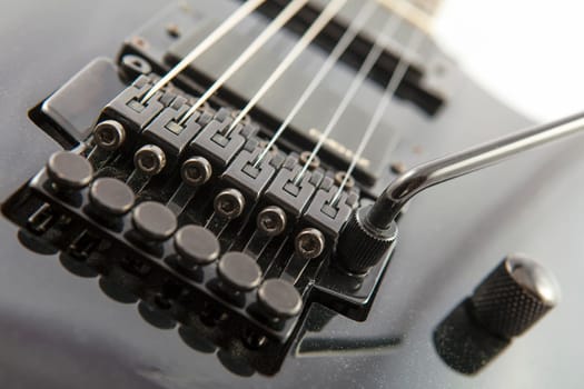 Electric guitar detail shots over white backdrop