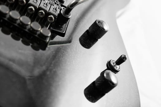 Electric guitar detail shots over white backdrop